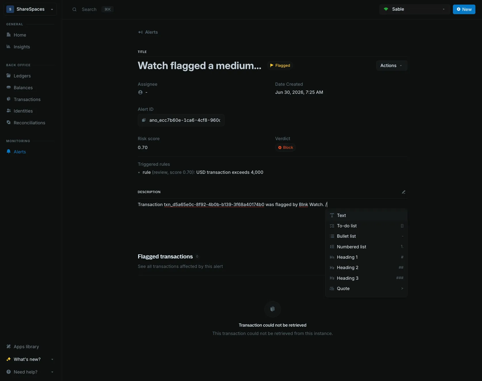 Alert description with the slash command menu open
