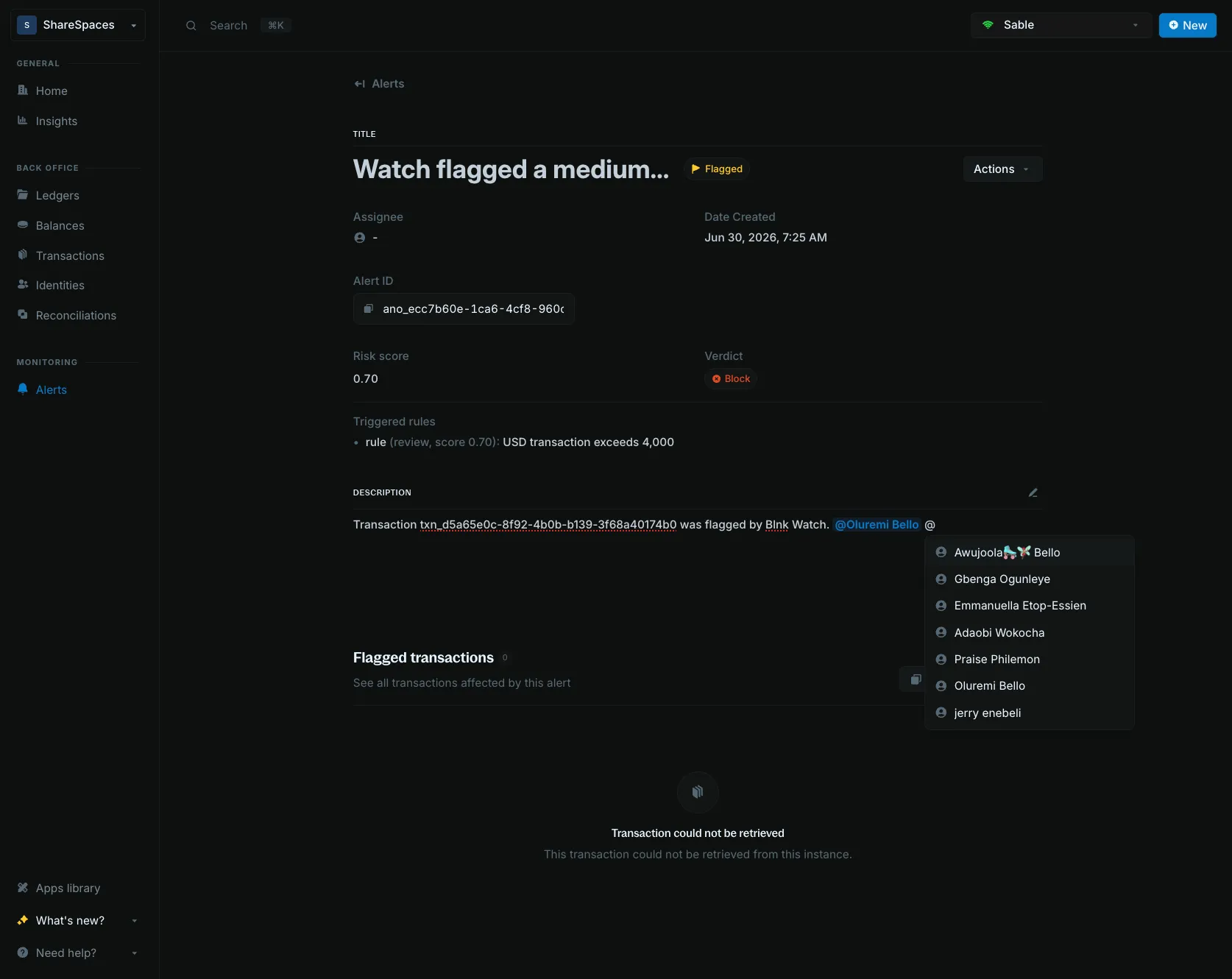 Alert description editor showing teammate mention suggestions